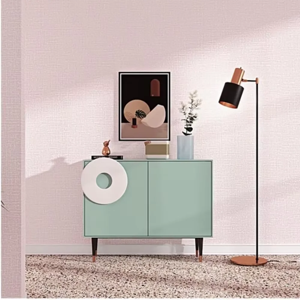 Hands applying the wallpaper onto a clean surface