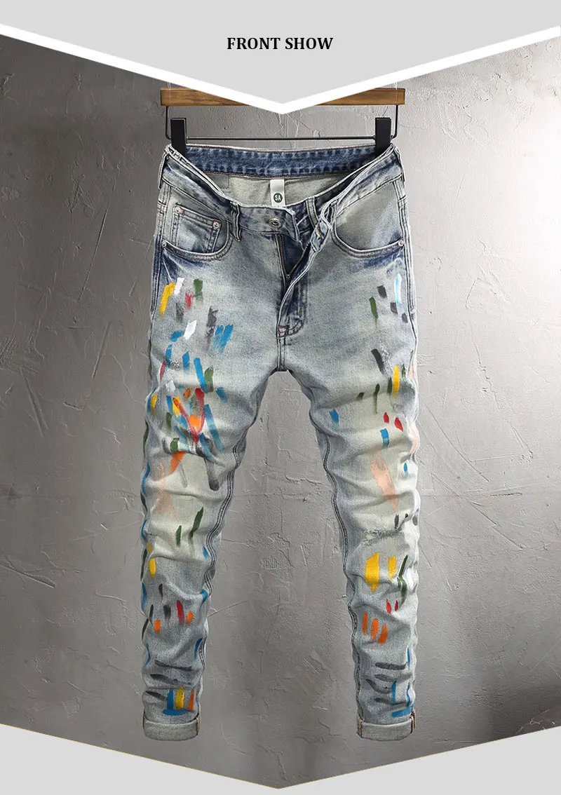 Front view of Drayven Edgewave Paint Splatter Distressed Jeans on hanger