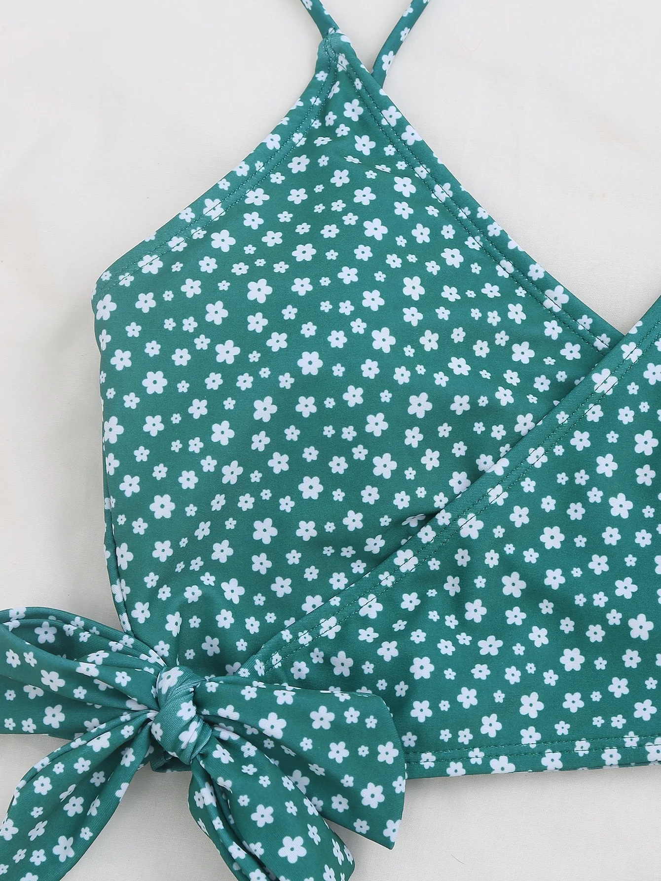 Women's green polka dot bikini swimsuit lace-up detail