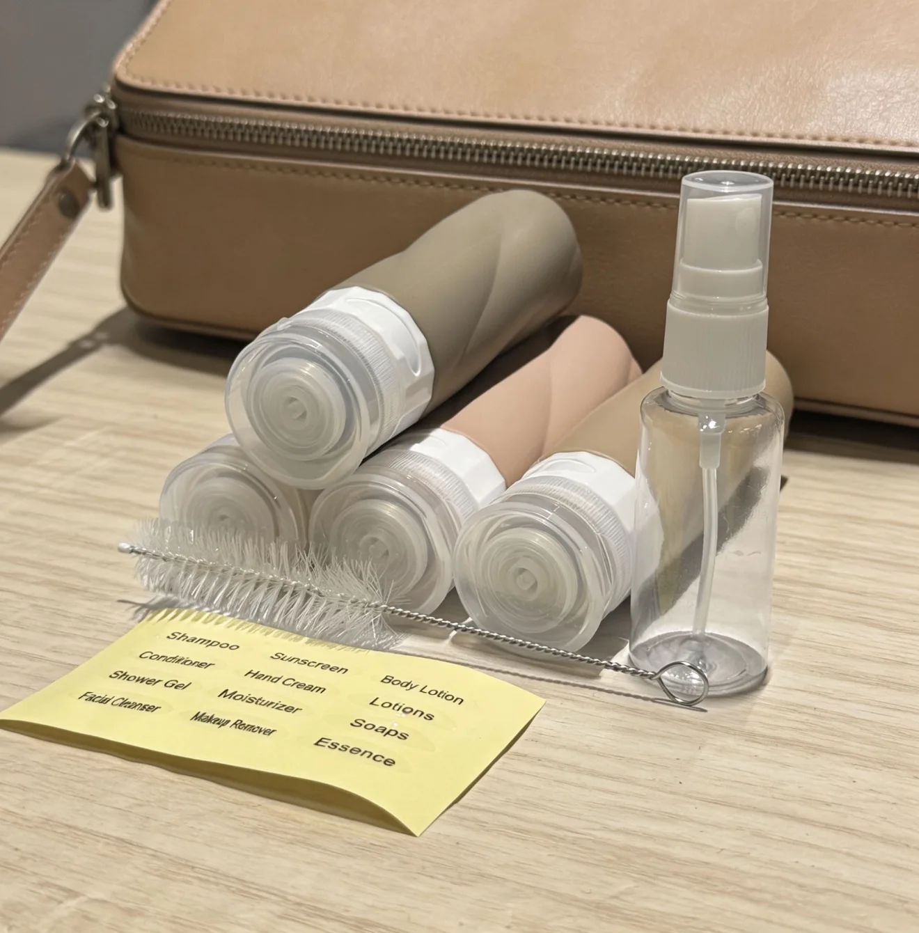 Deluxe Travel Toiletry Kit – Complete with Cleaning Brush, Stylish Travel Sticker, Handy 30ml Spray Bottle, Versatile Toiletry Bag, and Four 90ml Refillable Containers – Ideal for Cruises, Vacations, and Holiday Gifting
