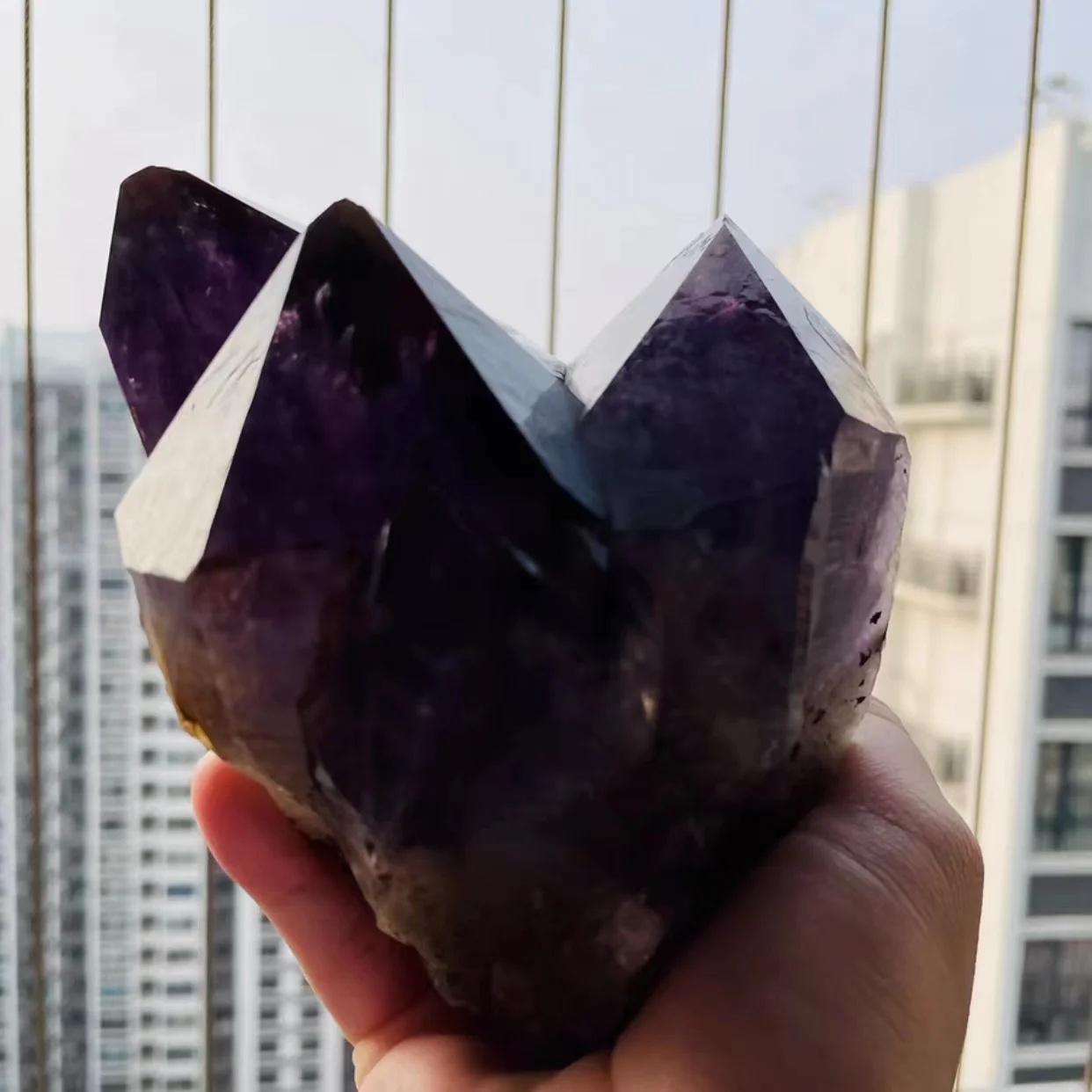 Natural raw amethyst surrounded by a powerful energy magnetic field of healing stone office home decoration crafts