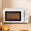 Home microwave oven. Lightweight, portable. Has 5-speed turntable for heat distribution. 2