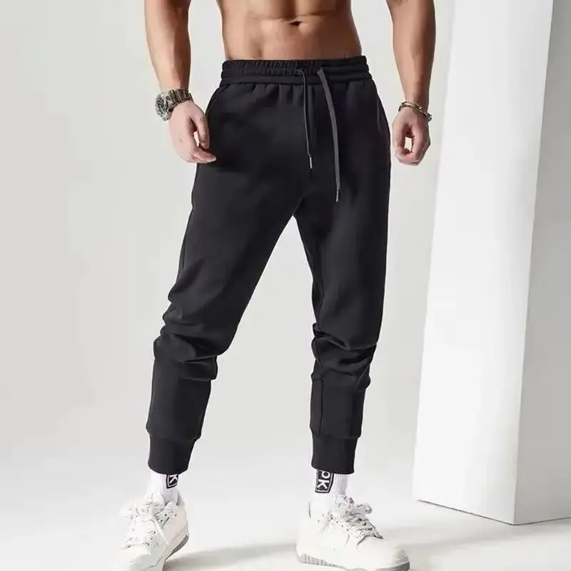 Muscle Fitness Brothers 새로운 여름 트렌드 캐주얼 스포츠 바지 야외 달리기 통기성 경량 작은 발바닥 바지