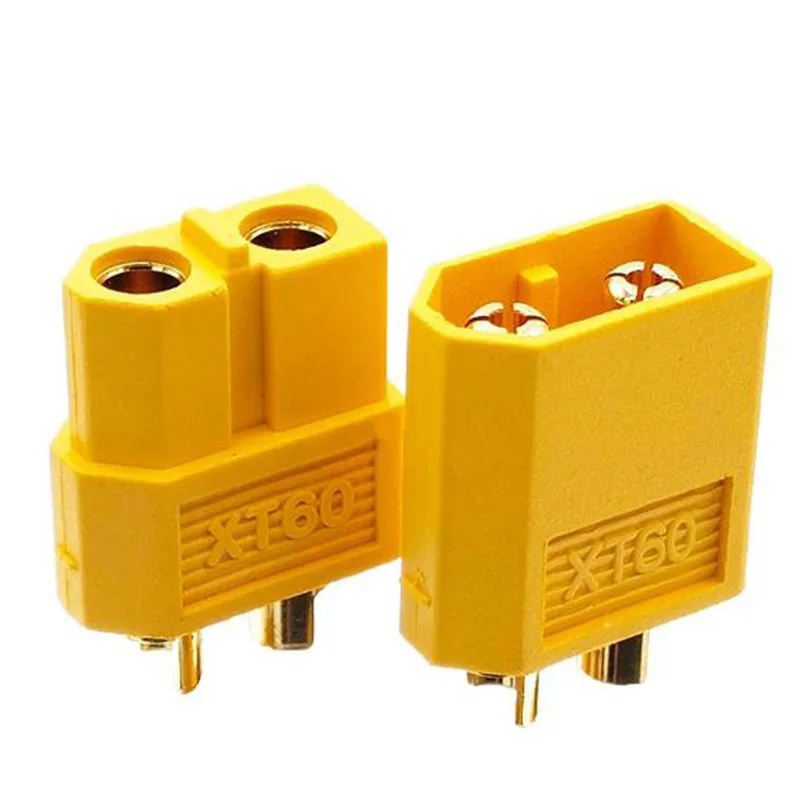 Connecteurs batterie XT60 pour drone FPV, vue rapprochée montrant les broches mâle et femelle.
