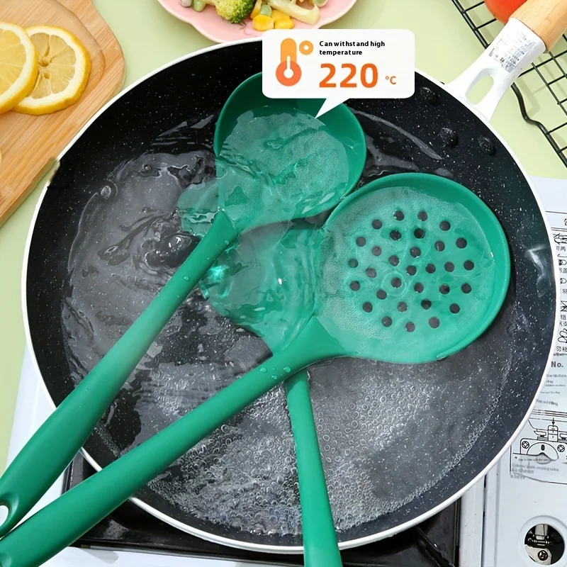 Three-piece Dark Green Silicone Kitchenware Set, Including A Silicone Spatula, A Spoon, and Slotted Spoon.