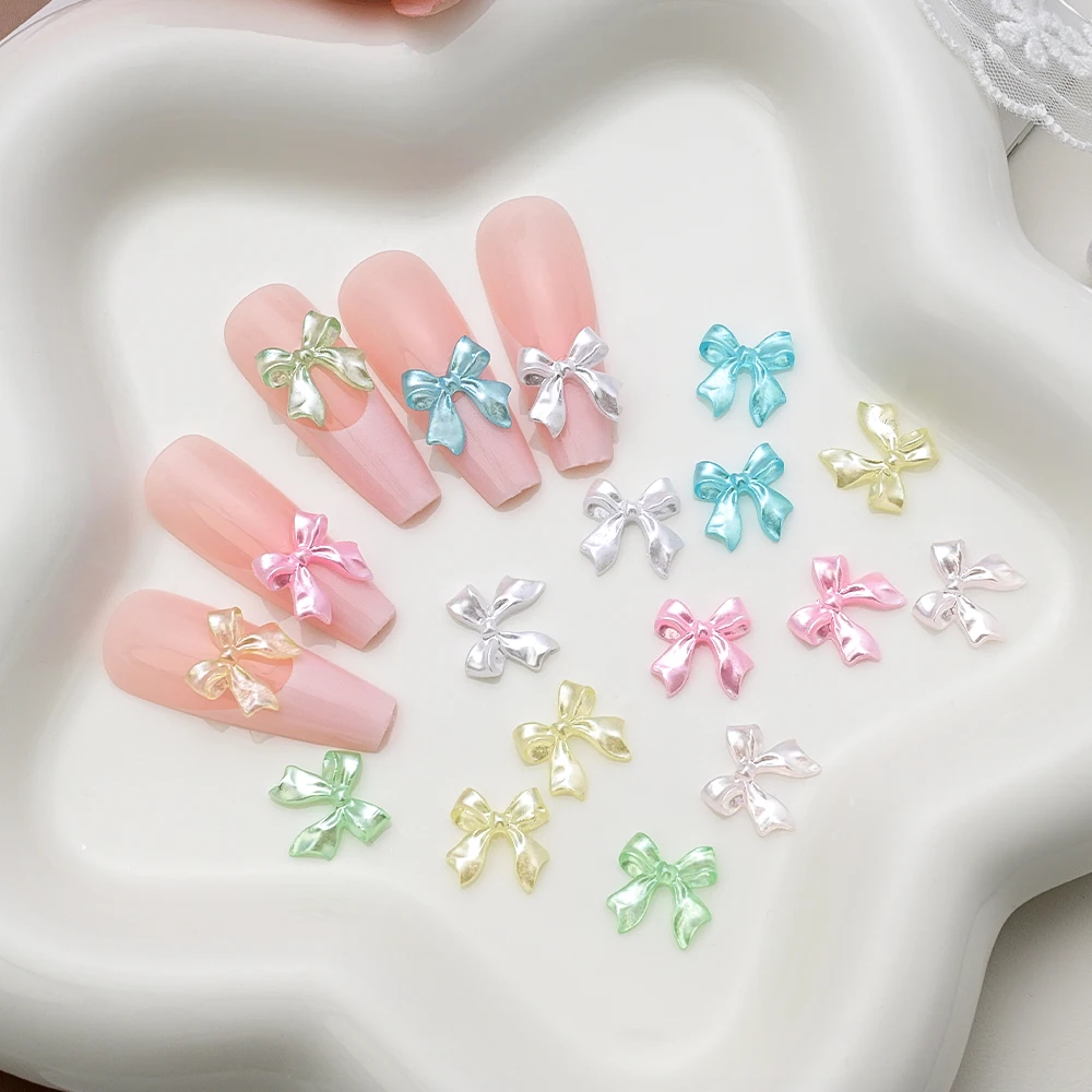 100Pcs 진주 흰색 광택 리본 활 네일 아트 매력 3D 우아한 Kawaii 수지 Bowknot 여름 네일 장식 매니큐어 Accessorie
