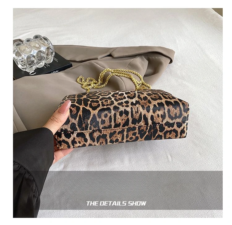 Carauana UNIU Leopard Clutch worn crossbody style