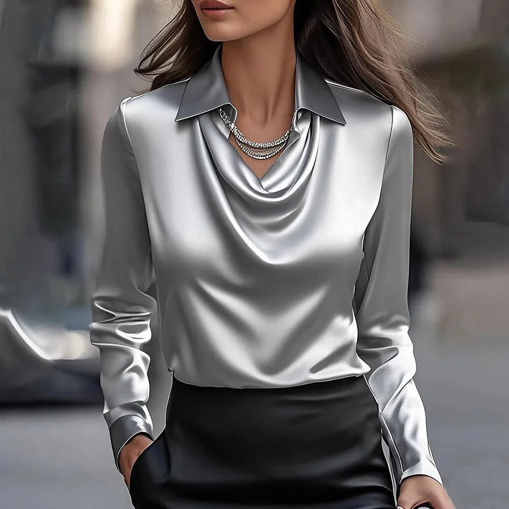 Woman wearing satin V-neck blouse with long sleeves in a chic office or casual setting 02