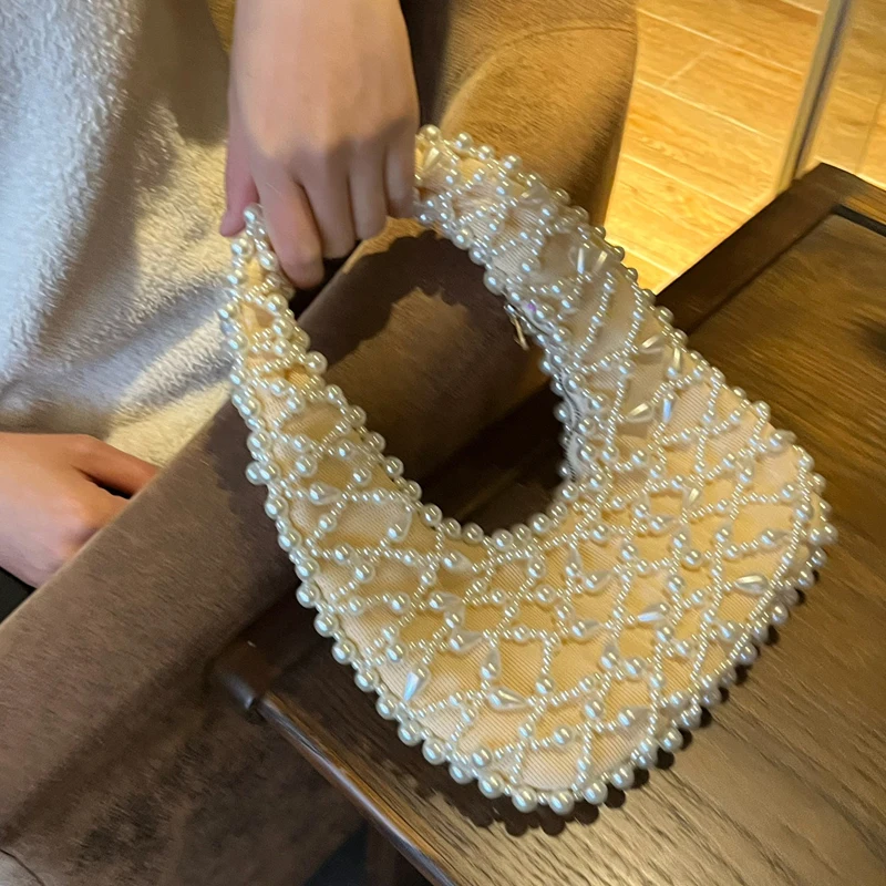 thumbnail image 1 of Bolsos de noche tejidos a mano con cuentas para mujer, bolsos de diseñador de lujo, monederos, novedad de 2024, con decoración hueca, pequeños bolsos para las axilas, 1 of 5
