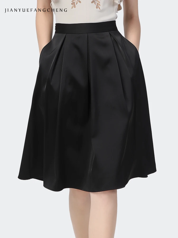 midi length black pleated skirt