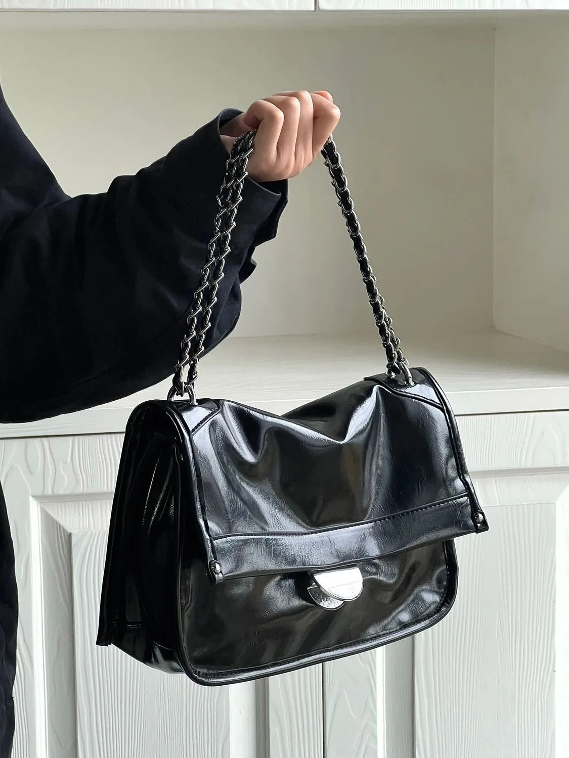 Lot 13 - Chanel: A black patent leather hinged box bag