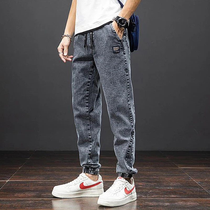 Large size elastic workwear jeans, men's ankle tied Harlan pants, wear-resistant and fat added, plus size trendy and loose