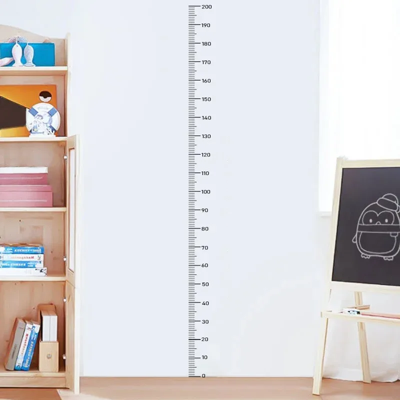 Peel-and-stick application of growth chart decal