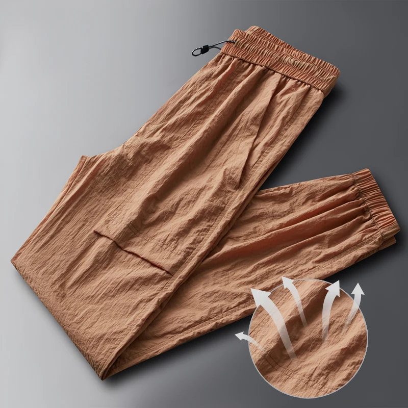 Fashion Elastic Pockets Spliced Solid Color Casual Pants Men's Clothing 2024 Summer New Loose Young Style High Waist Pants