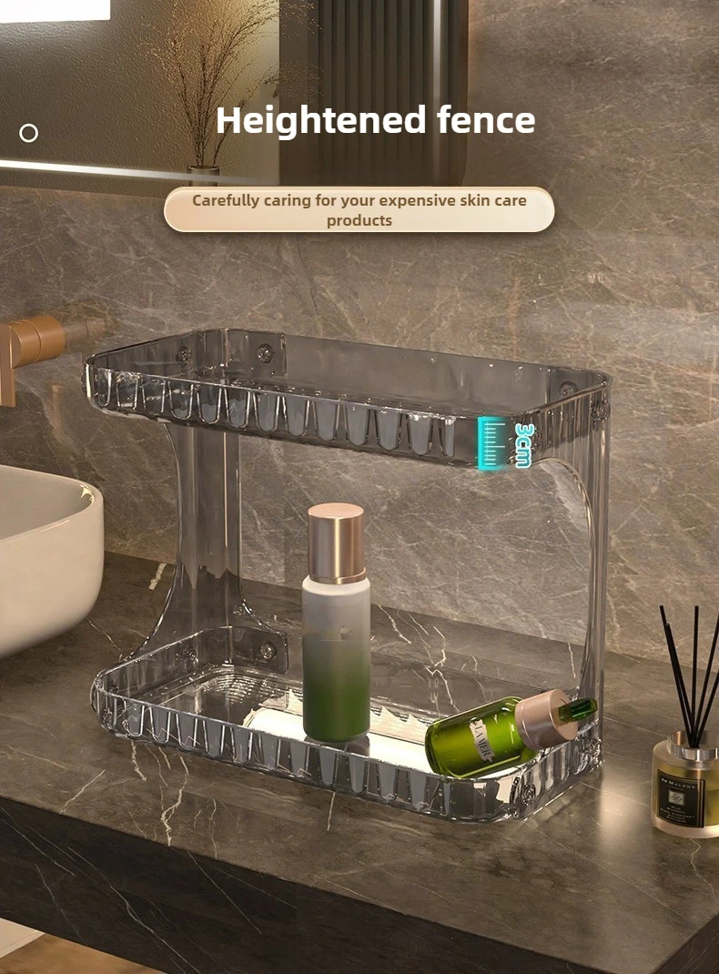 White double-layer bathroom rack holding skincare bottles and cosmetics on a counter.