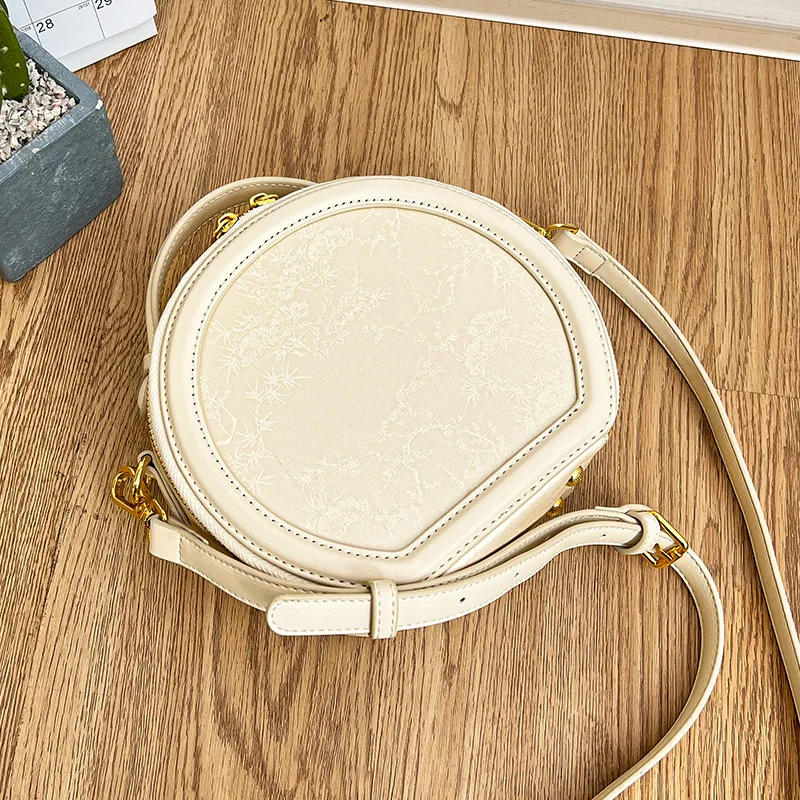 thumbnail image 1 of Bolso de mujer 2024 Nuevo bolso redondo pequeño Textura de alta gama Tendencia de moda Bordado Bolso cruzado ligero de un solo hombro, 1 of 5