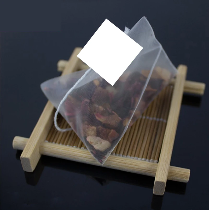 

100pcs/lot Empty Pyramid Teabag White Label Nylon Tea Infuser Strainer Scented Bags Filter