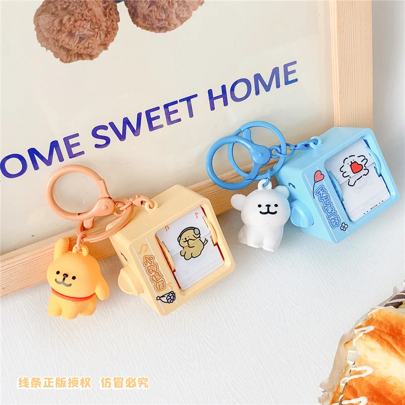 Miniso Creative Unpacking School Bag Ciondolo Portachiavi Line Puppy Turning Machine Ciondolo Dancing Puppy Pendant Funny Little Gift
