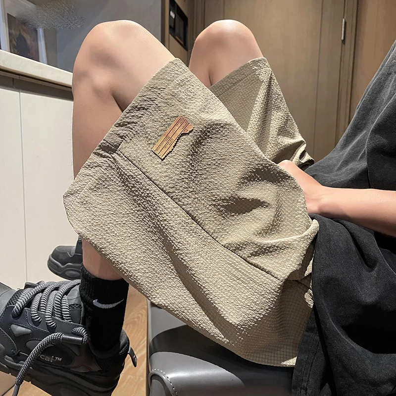 Fashion Solid Color Spliced Pockets Casual Shorts Men's Clothing 2024 Summer New Loose Elastic Lace Up High Waist Knee Shorts