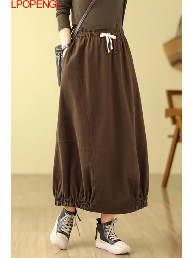 

2023 New Woman Autumn Solid Color Washed Literary Vintage Drawstring Streetwear Elastic Waist Temperament A-line Mid-calf Skirt