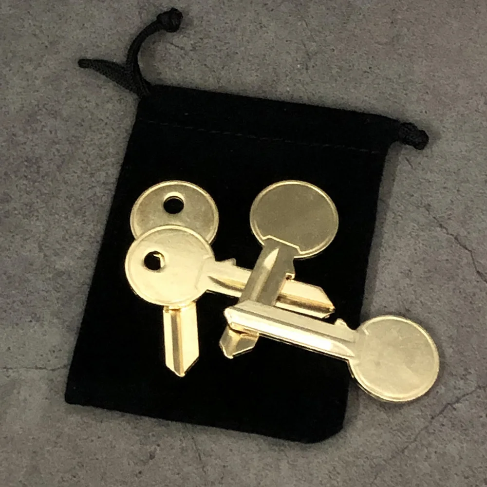 Keymaster Gold (Gimmicks and Instructions) by Craig Petty Magic Tricks Moving Hole on Key Close Up Illusions Mentalism Props Fun craig armstrong plunket