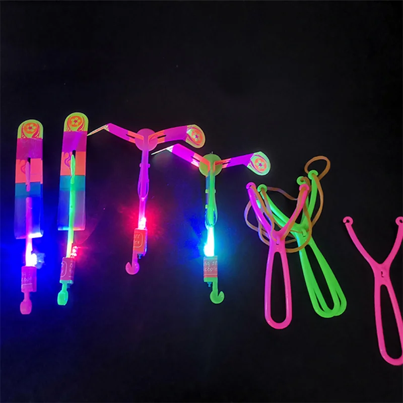 Jouet lumineux à LED avec élastique, 1/3/5/10 pièces, flèche, fusée,  hélicoptère volant, lumière, fête, cadeau amusant, catapulte - AliExpress