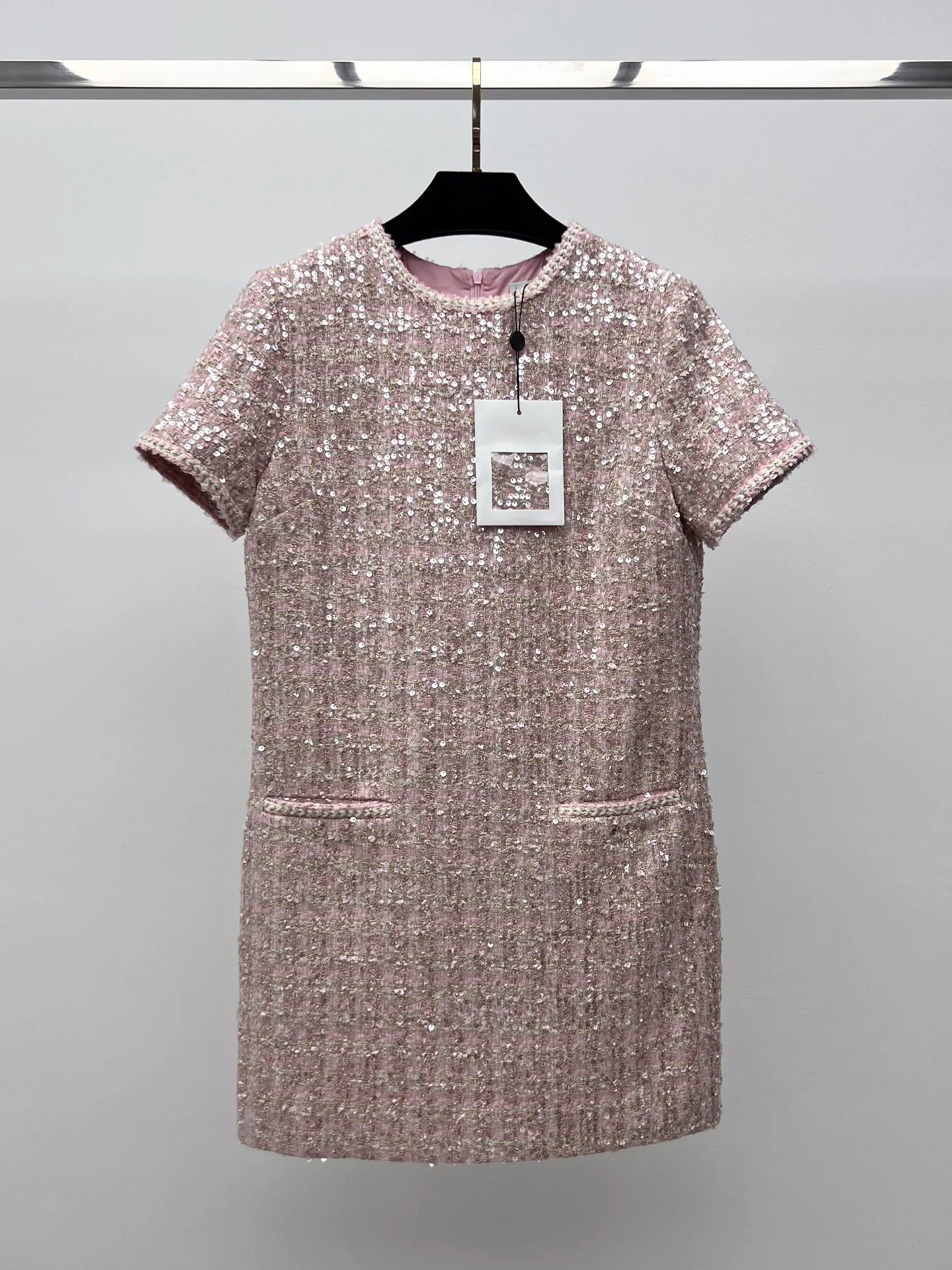 

The new gold sequin soft tweed dress with twist trim neckline and sleeves is elegant
