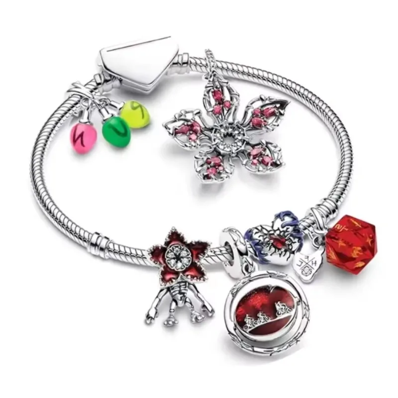Close-up of detailed magic flower monster charm in silver and colored accents