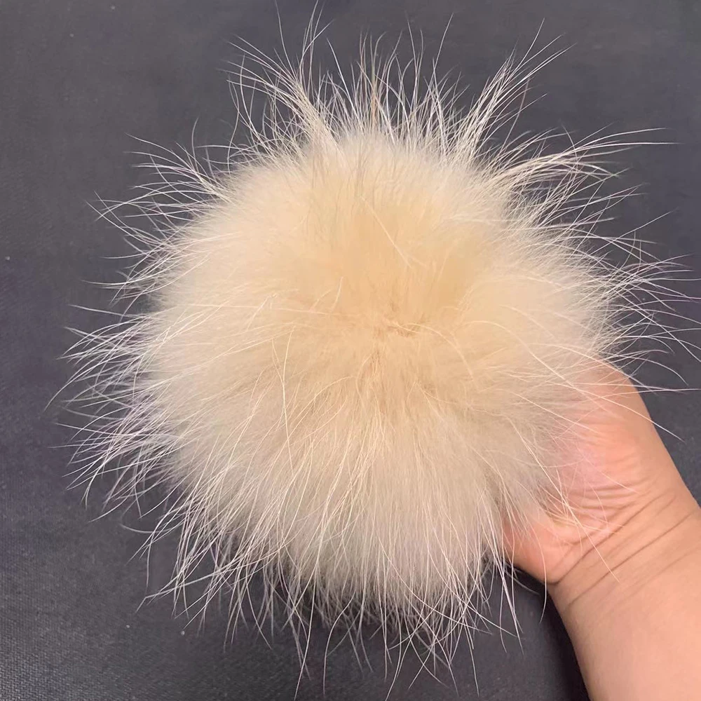 Fur pompoms for hats made of natural fox and raccoon fur