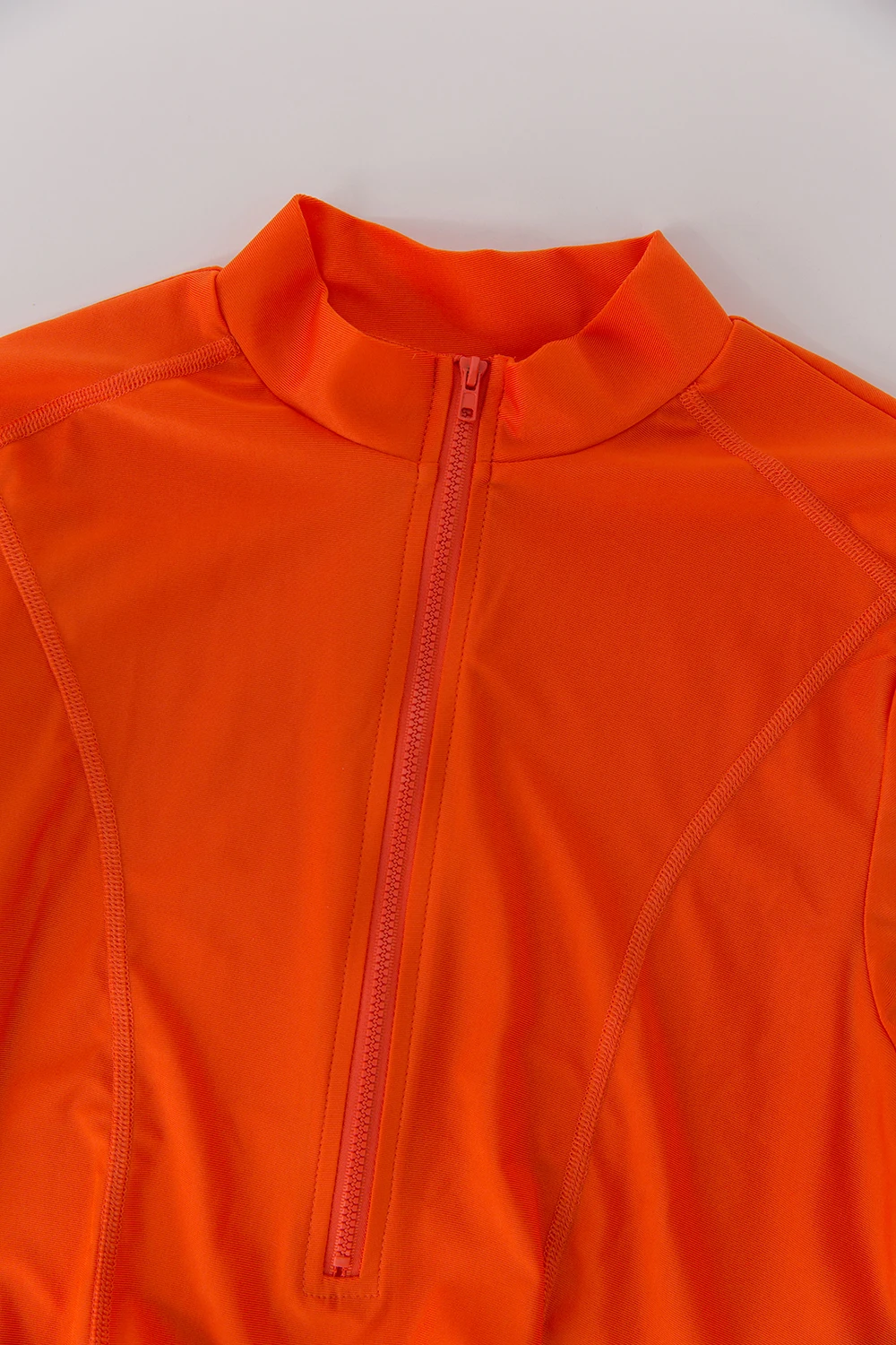 Full outfit shown with ocean background in modest swim style