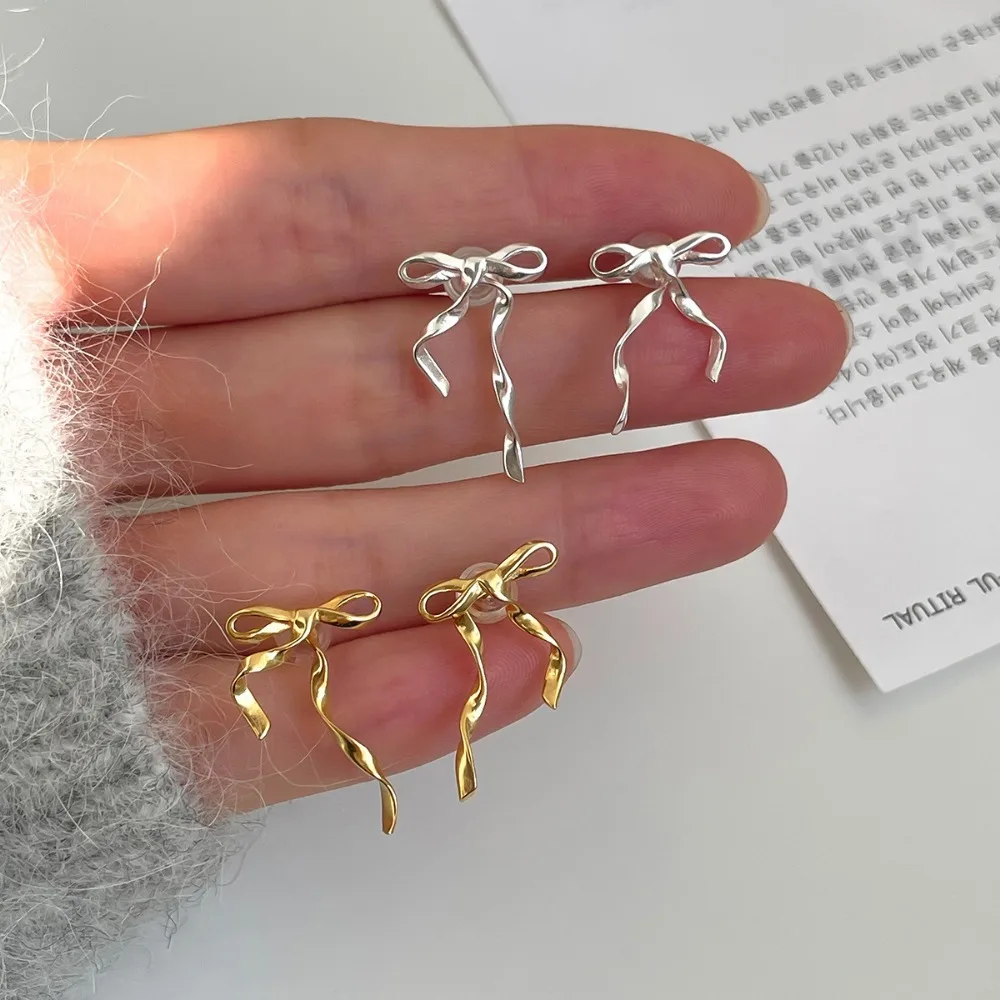 

Simple Silver Color Bow Stud Earrings for Women Exquisite Sweet Metal Hollow Line Piercing Earrings Jewelry Y2K Ear Accessories