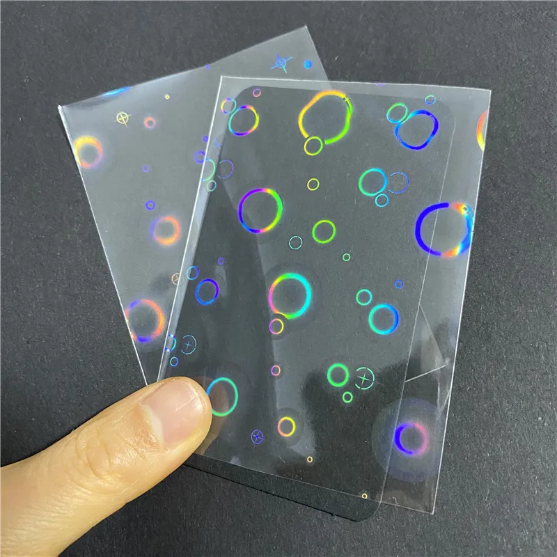 100 Pcs/set Bubble Foil Laser Holographic Protective Film Flashing Card Sleeves Protector for Board Cards Holder Shield Cover 100pcs perfect fit kpop photo shinny cards sleeves gemstone rainbow stardust heart shape laser flash holographic idol protecter