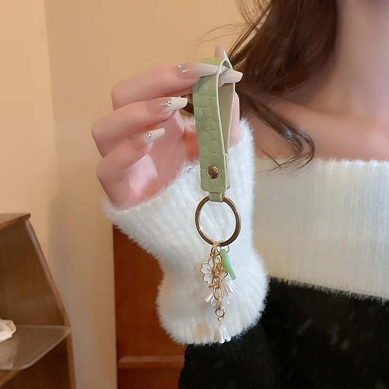 Fresh and Elegant Bell Orchid Keychain: Green Imitation Pearl and Leather Resin Alloy Accessory