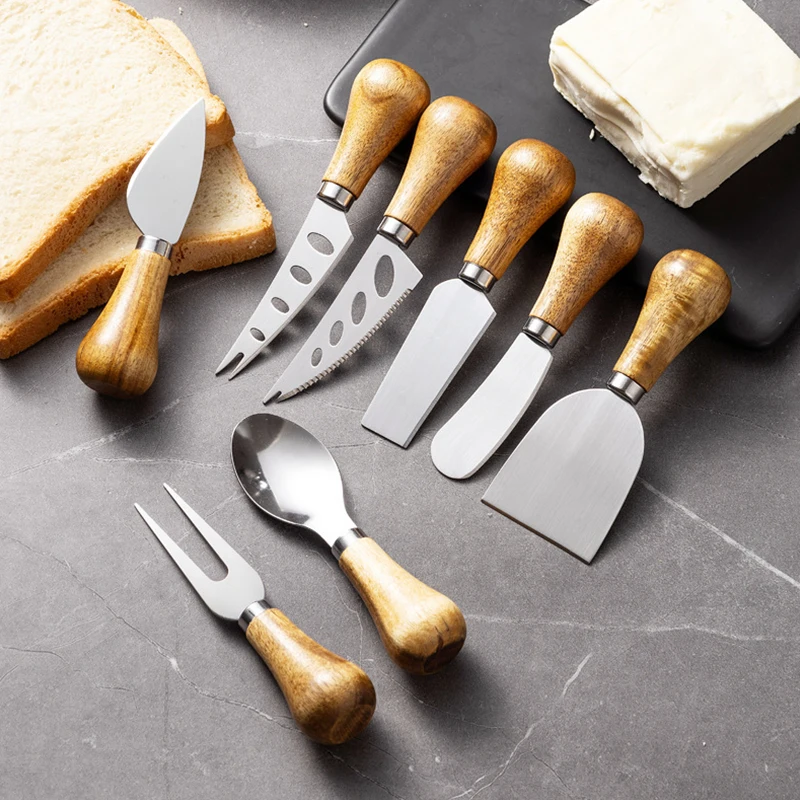 Cheese knife; butter knife; mini stand-up bread spreader; jam and butter scraper.