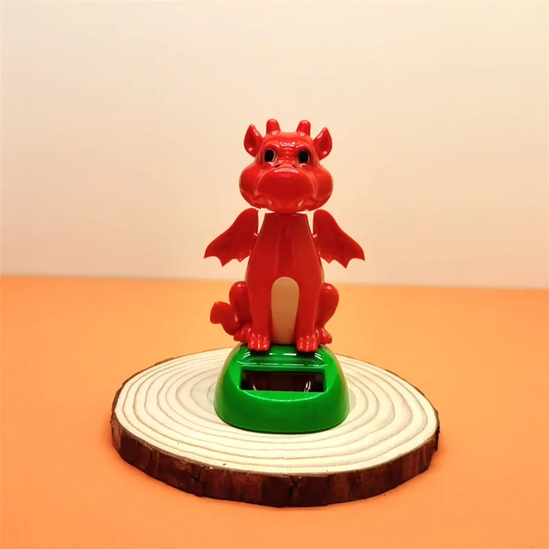 

Огонь Дракон Солнечный автоматический качели кукла автомобиль Bobble орнамент креативный автомобиль орнамент
