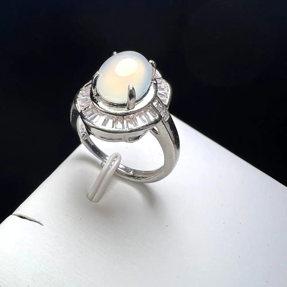 Silver ring, set with a green stone in a circle of white… | Drouot.com