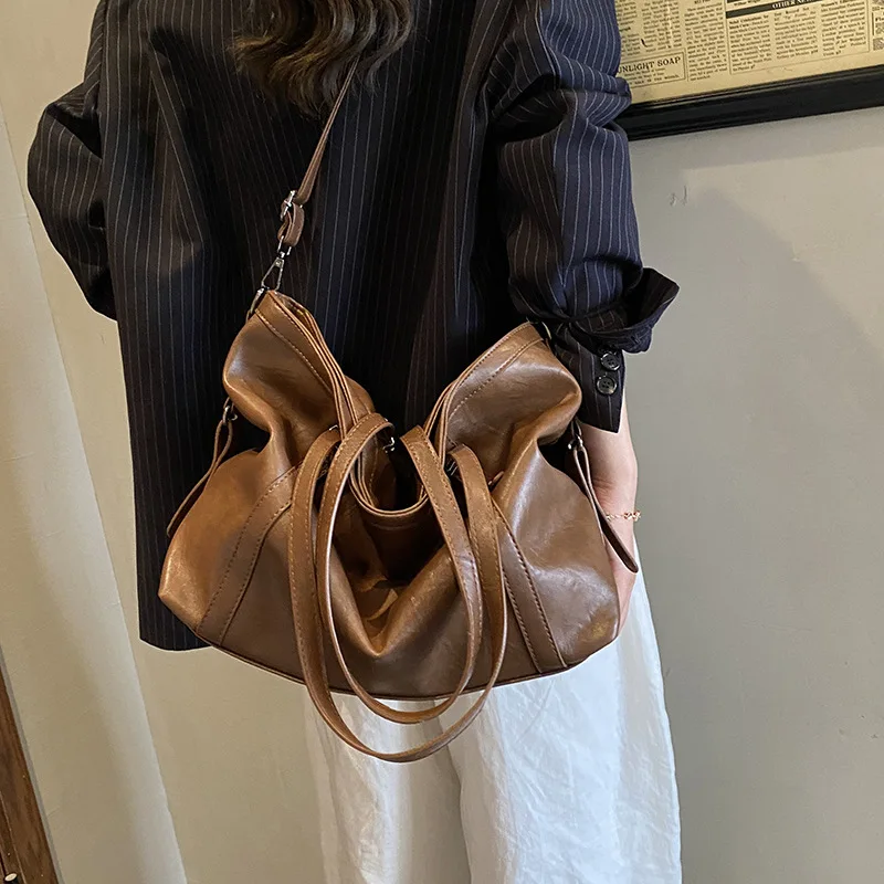 Large capacity women's versatile college style single shoulder soft leather tote bag for casual commuting and crossbody dual-use