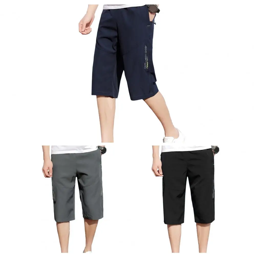 Description Picture 2 of itemSolid Color Cropped Pants Men's Elastic Waist Cropped Pants with Zipper Pockets Soft Breathable Mid-calf for Comfort for Casual