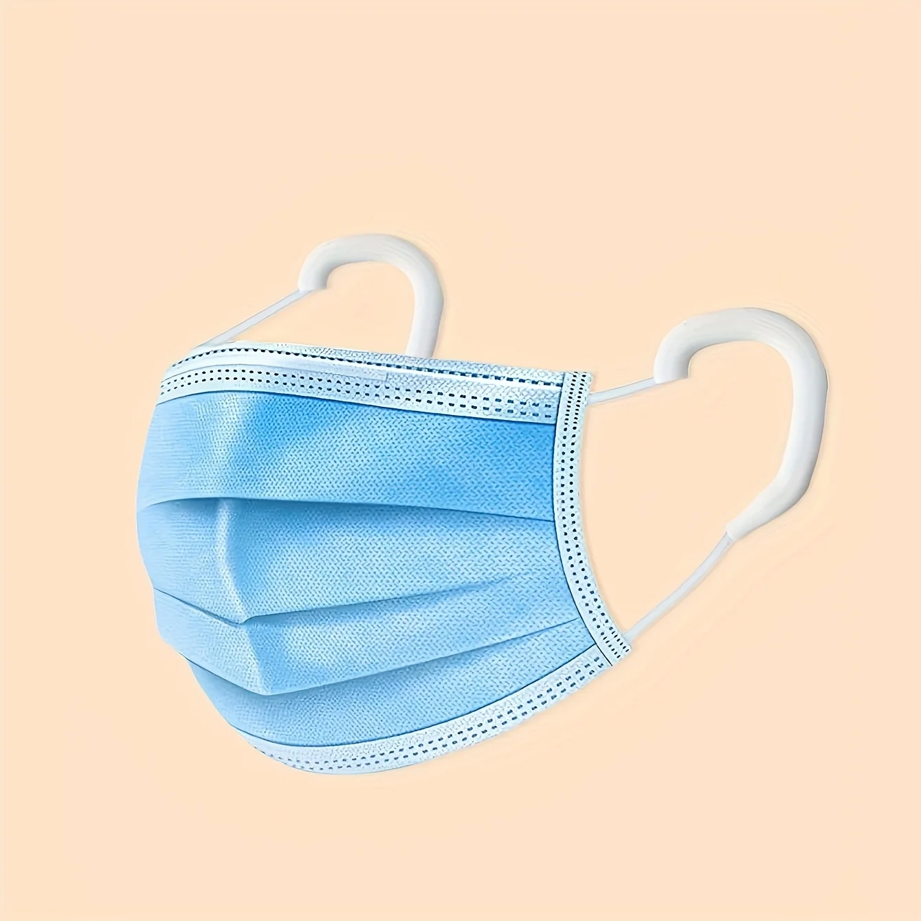 Paquet de masques chirurgicaux Type IIR ouvert montrant les masques empilés, idéal pour achat en lot.