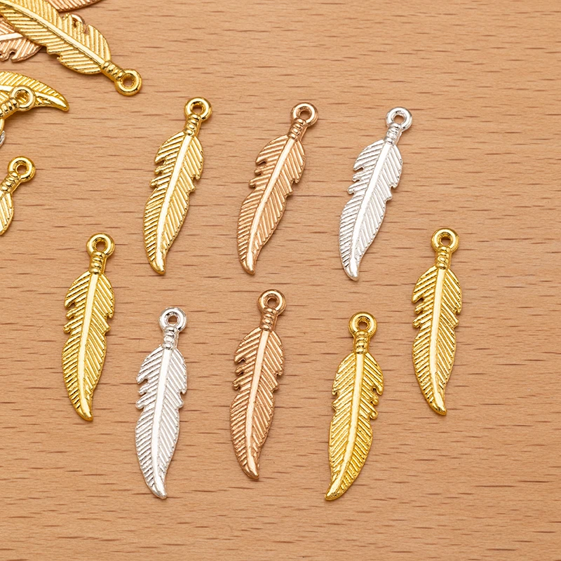 50 Stück 7 x 26 mm goldene Metall-Zink-Legierung Federn Charms Anhänger für DIY handgemachte Handwerk Ohrringe Halskette Schlüsselanhänger Schmuckherstellung – Detail 5