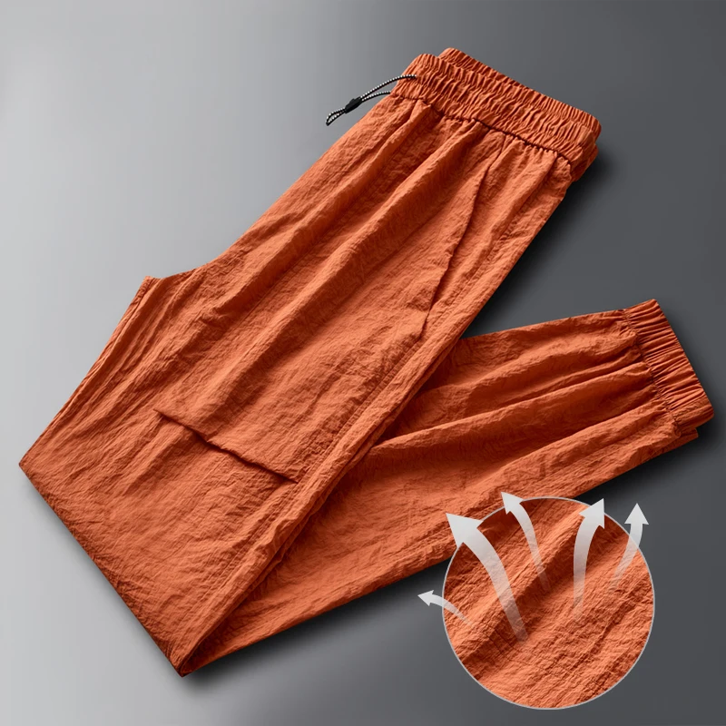 Fashion Elastic Pockets Spliced Solid Color Casual Pants Men's Clothing 2024 Summer New Loose Young Style High Waist Pants
