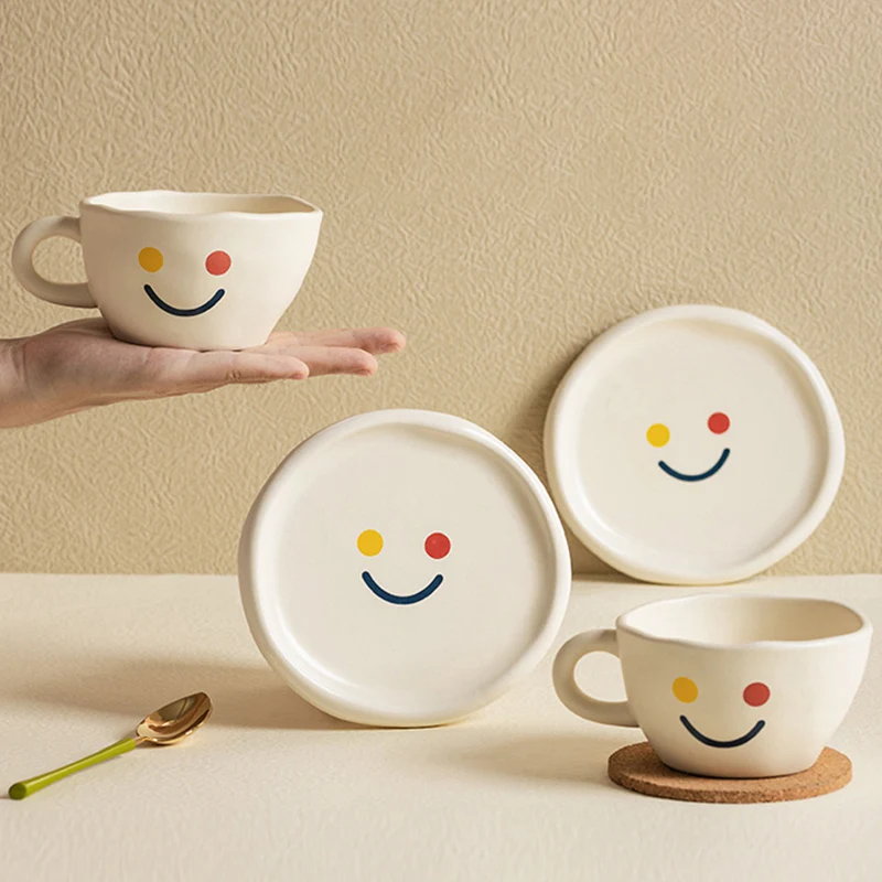 https://ae01.alicdn.com/kf/S3d61b6560a9d431d91e734faf9267b93R/NEW-260ML-Handmade-Irregular-Ceramic-Coffee-Cup-And-Saucer-Set-Smile-Face-Painted-Reusable-Milk-Tea.jpg