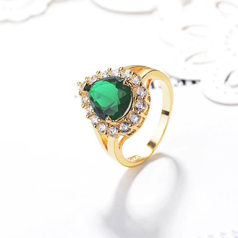 vintage-inspired green stone engagement ring