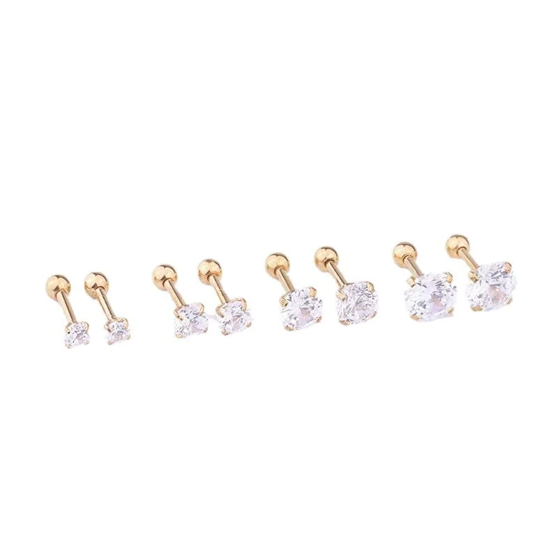 Close-up of small geometric crystal stud earring