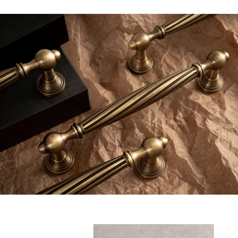 single hole antique brass knob spiral style