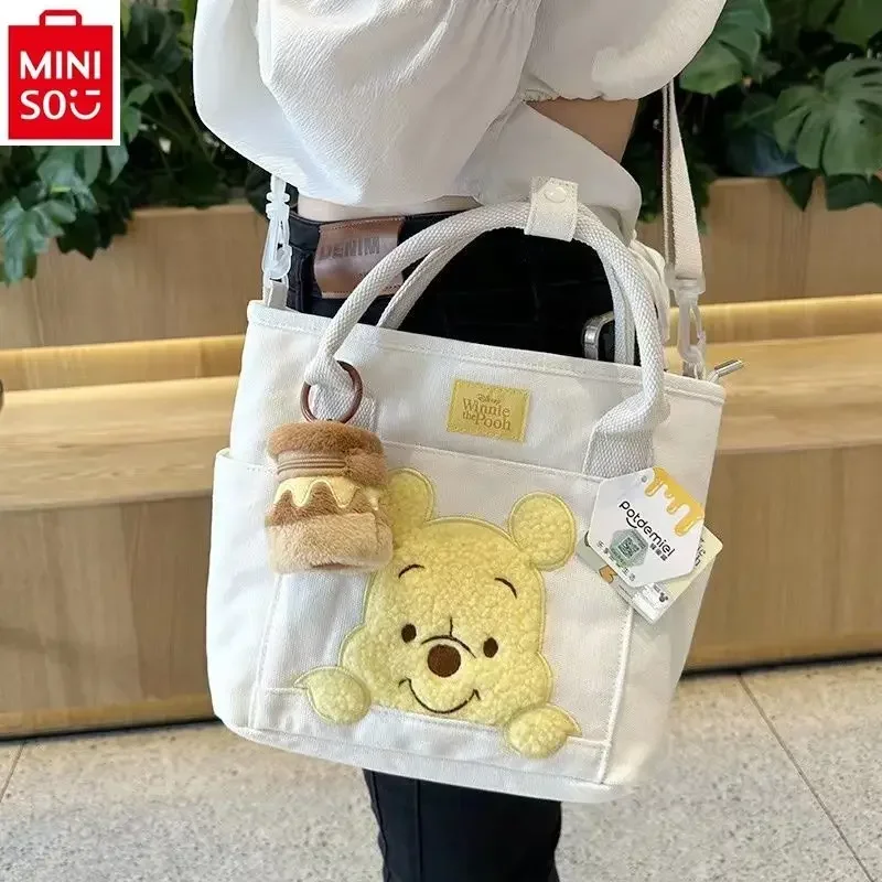 MINISO Disney Fashion Canvas Large Capacity Handbag Cute Cartoon Winnie Bear Multi functional Women's Crossbody Bag
