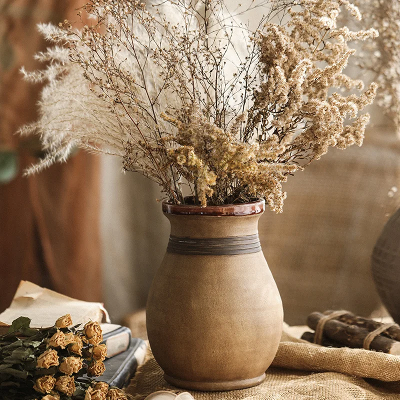 

Vintage distressed stoneware vase ornaments, yellow wabi-sabi style homestay, living room, dried flowers, flower arrangement