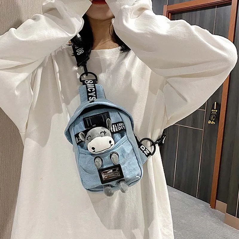 Cute bear canvas shoulder bag with adjustable strap, plush bear accent, and casual design for girls, women, and kids