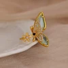 Bagues de luxe en Zircon coloré bleu pour femmes, en acier inoxydable plaqué or, fleur papillon, bijoux brillants de fête exquis, 2025