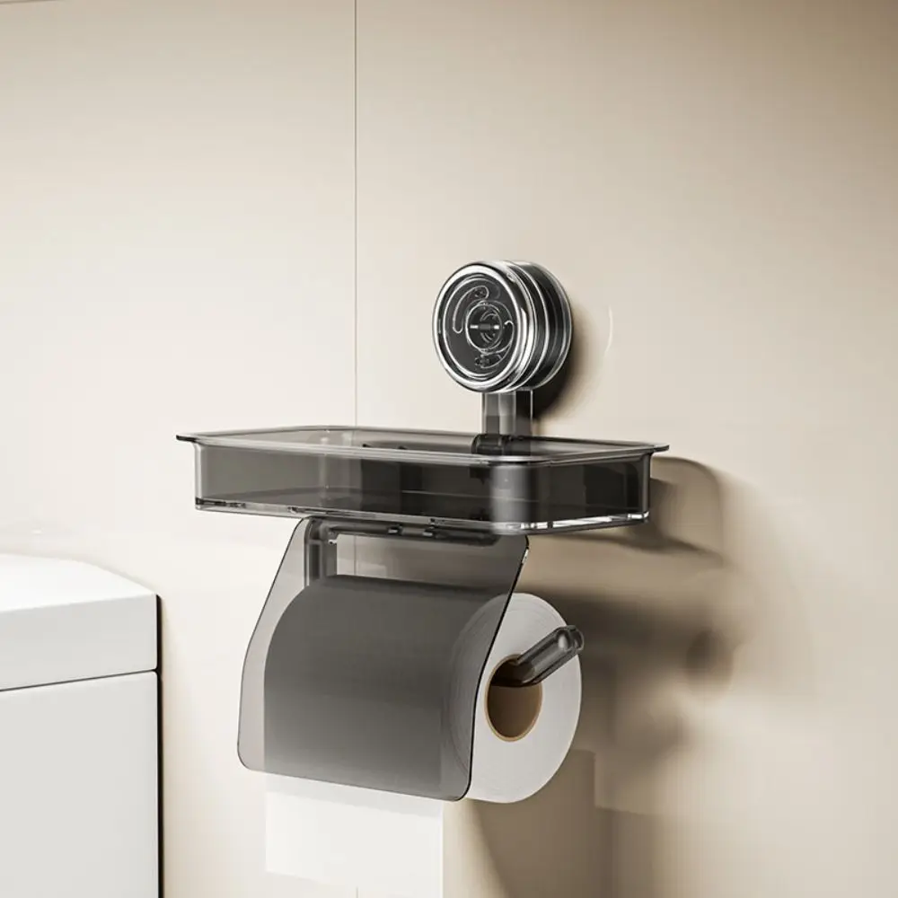 Suction cup toilet paper holder in transparent large size mounted on bathroom tile
